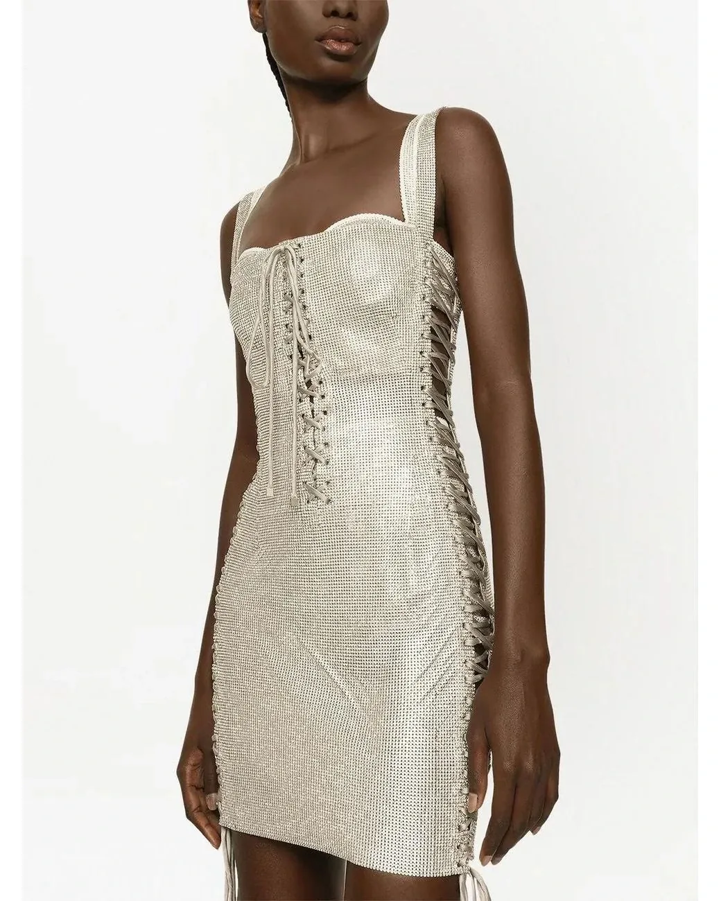 Model wearing a white crystal lace-up Dolce & Gabbana mini dress
