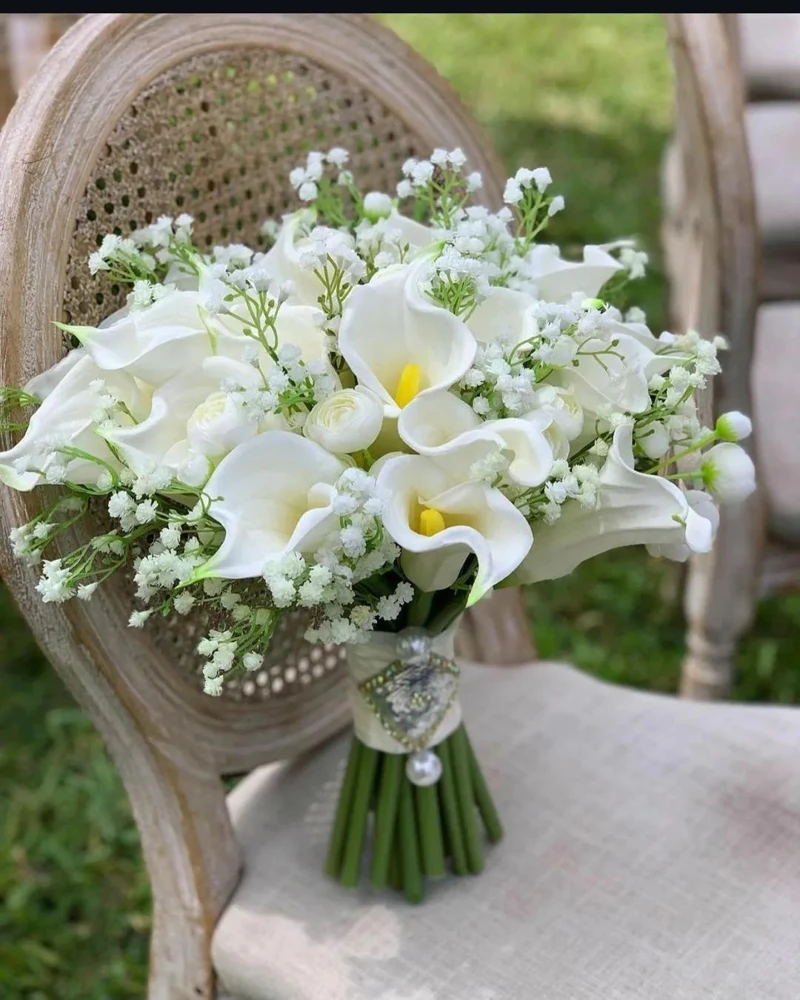 Elegant hand-tied bouquet of white calla lilies