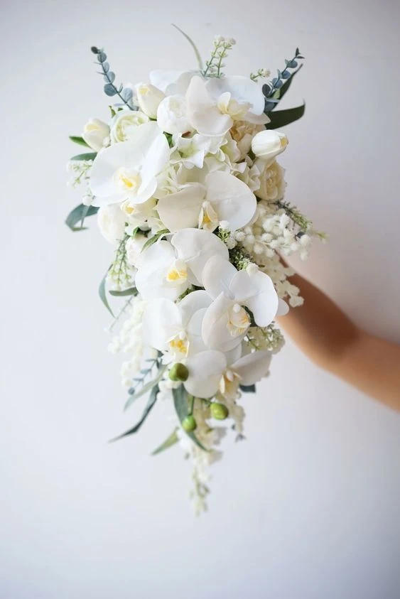 Airy all-white cascading orchid bouquet