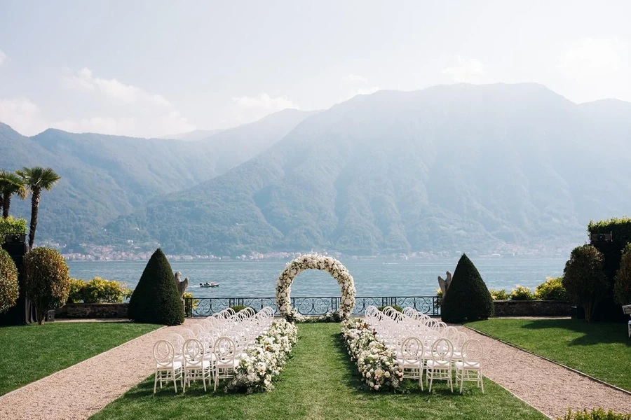 Elegant white wedding ceremony on the shore of Lake Como