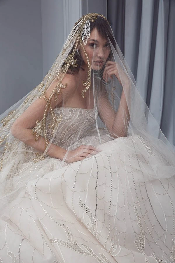 Ivory strapless ball gown with embroidered veil from Steven Khalil's 2027 bridal collection