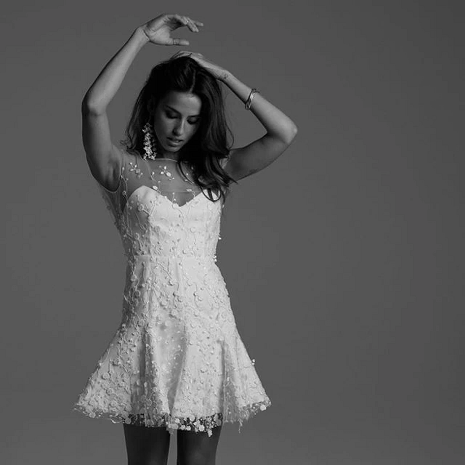 Bride in a sparkling white reception dress