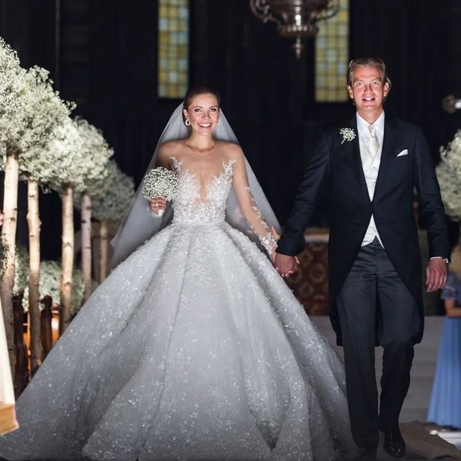 Victoria Swarovski in her crystal-covered Michael Cinco wedding gown beside her groom