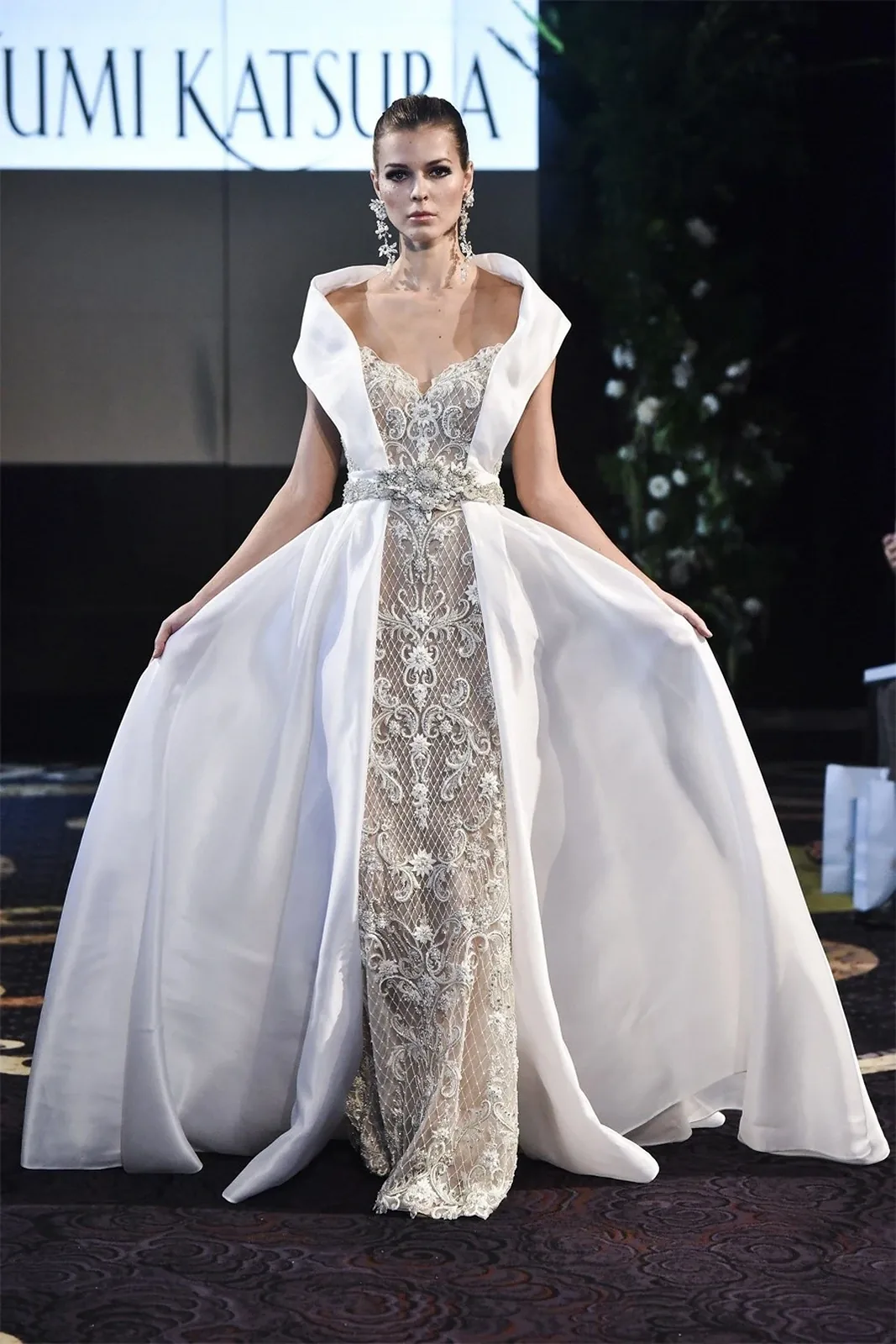 Model presenting Yumi Katsura's white and gold diamond wedding dress