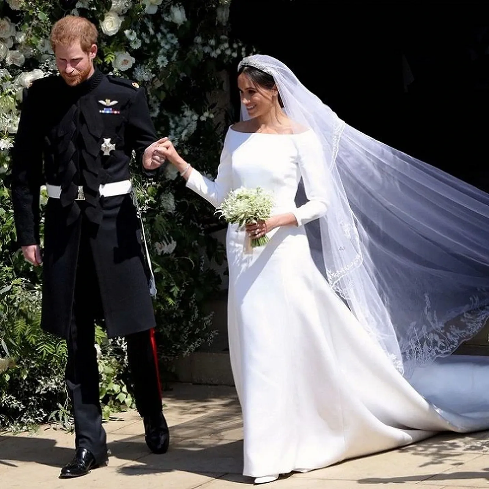 Meghan Markle in her minimalist Givenchy wedding dress and long veil