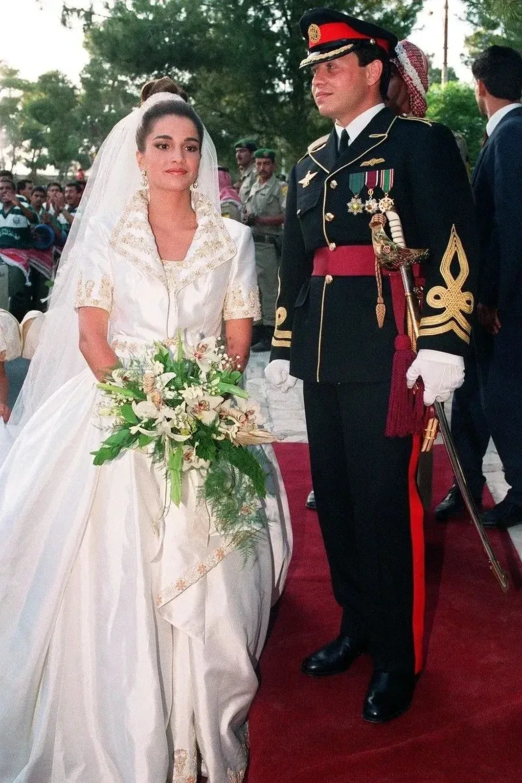 Queen Rania of Jordan in her gold-embroidered wedding gown