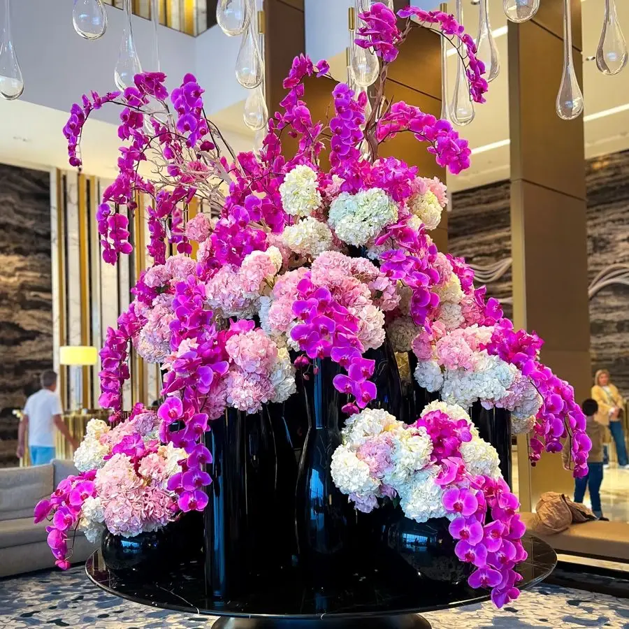 Sculptural display of vivid pink orchids
