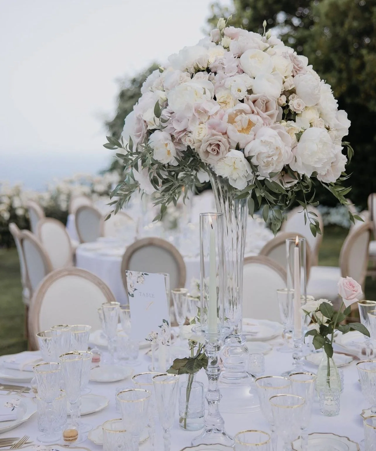 Elegant ivory and blush wedding table with crystal and flowers
