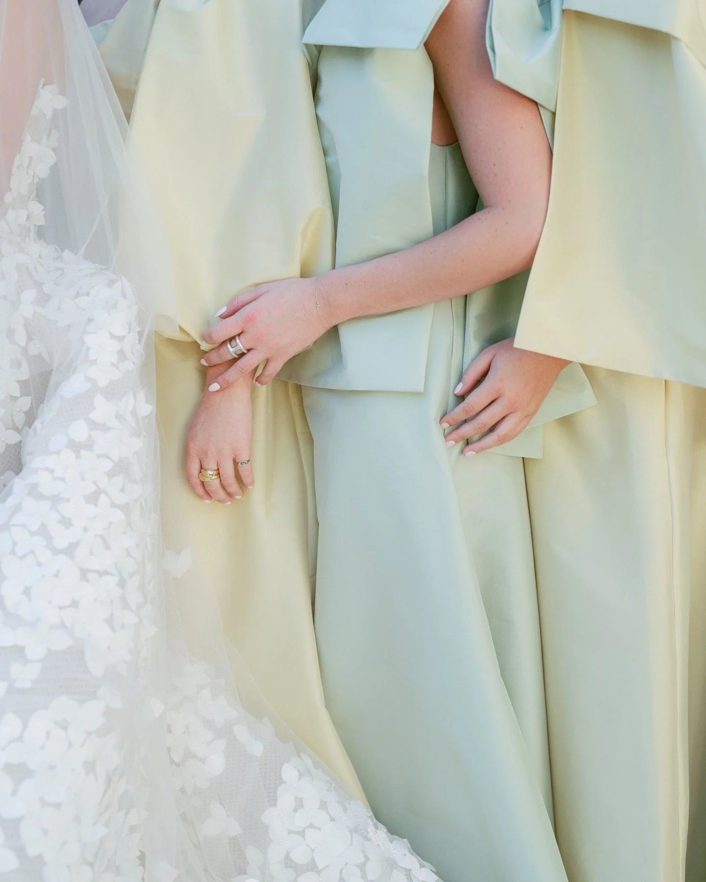 Bridesmaids in matcha, buttercream and misty blue dresses